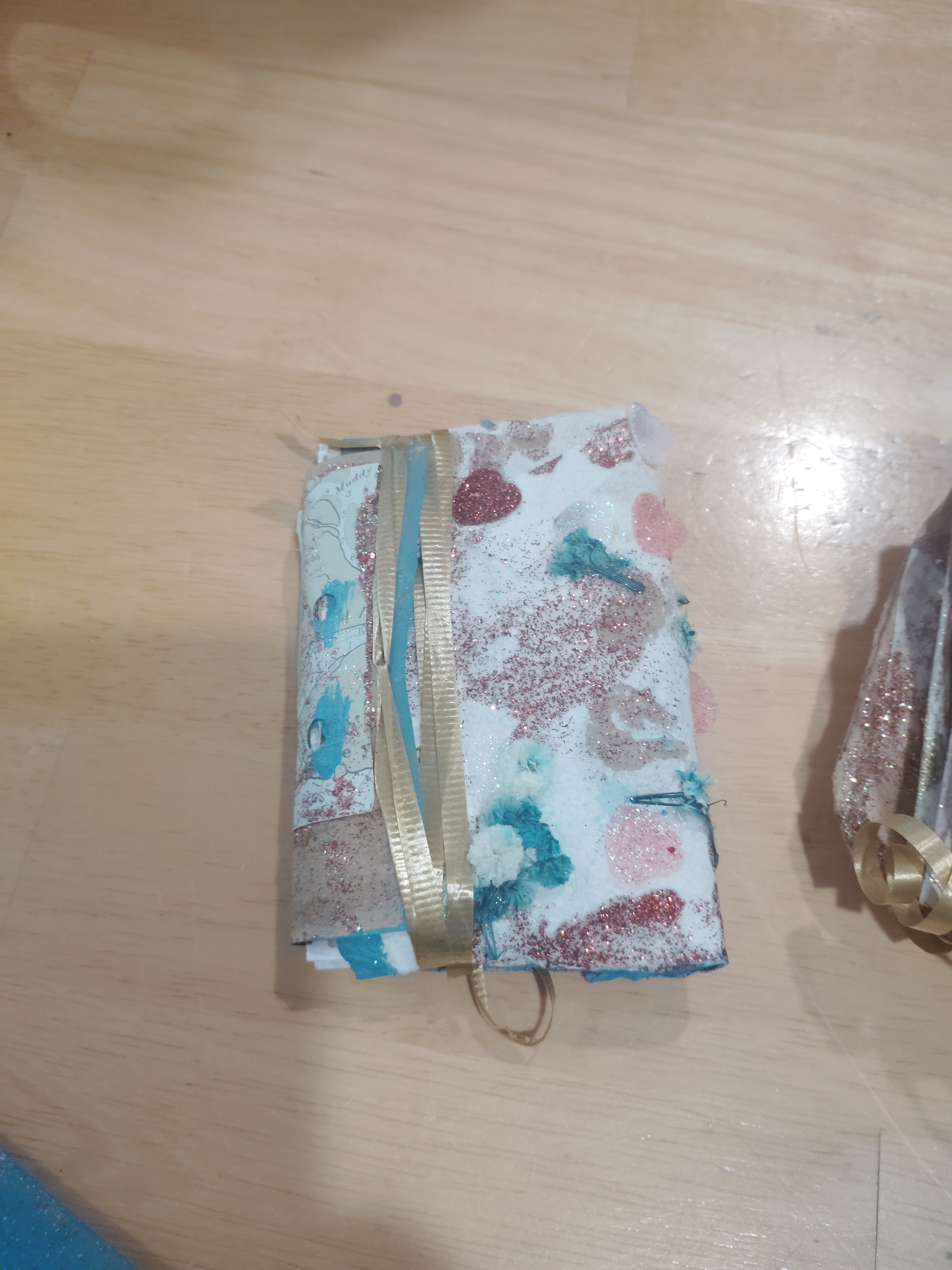 A Fairy Treasure Book with lace, ribbon, and dried flower details.
